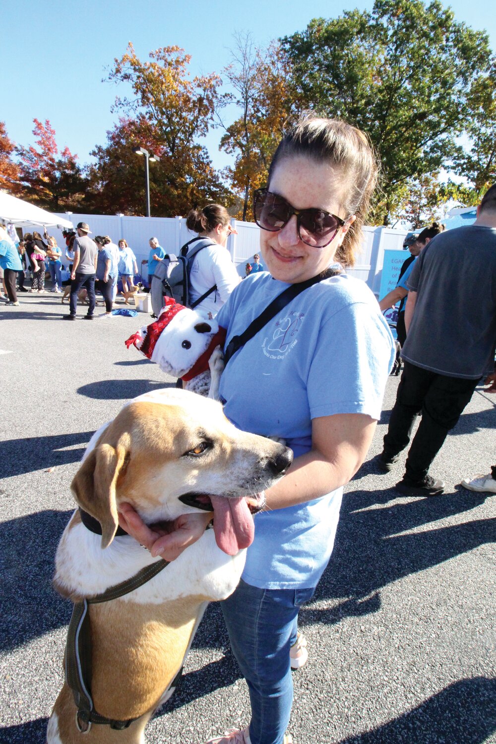 TEMPORARY MOM: Pam Morin with William at the adoption event.  William displayed his friendly disposition greeting dogs and people with wags.