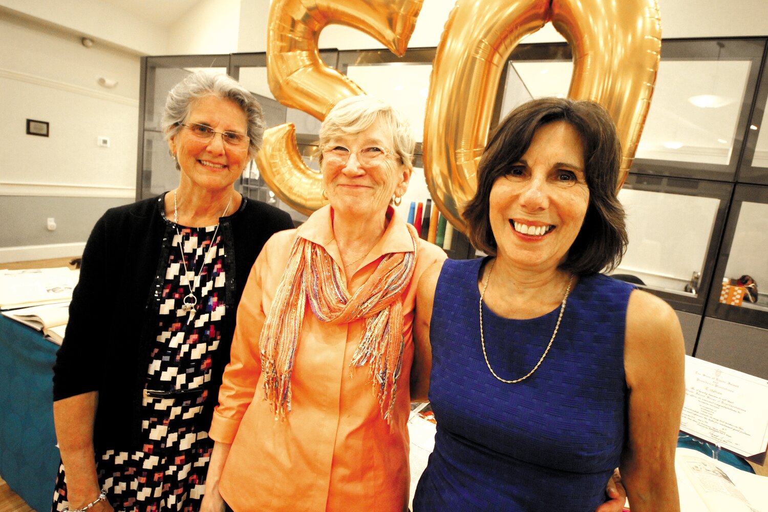 DYNAMIC TRIO: Three of the women who played critical roles in the programs and development of Cornerstone gather to share memories. From left they are Kim Morris who served as activities director of 35 years; Andrea Whitney who preceded her and Roberta Merkle who guided the center through its growth and is now executive vice president of strategic initiatives for Saint Elizabeth Community. (Warwick Beacon photos)