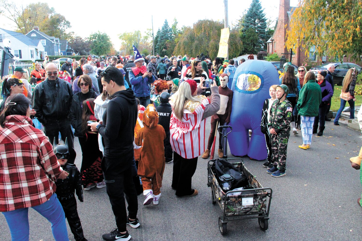PRE-PARADE: Super heroes, ghouls, ghosts, robots, witches and just about every imaginable character gathered at the Chapman Avenue home of Stacy Capone for the start of Greenwood’s annual Halloween parade.