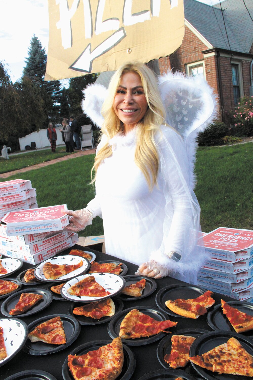 BEST JOB: School Committee member Leah Hazlewood was an angel when it came to handing out pizza. She said she loved doing it because she got to meet everyone.