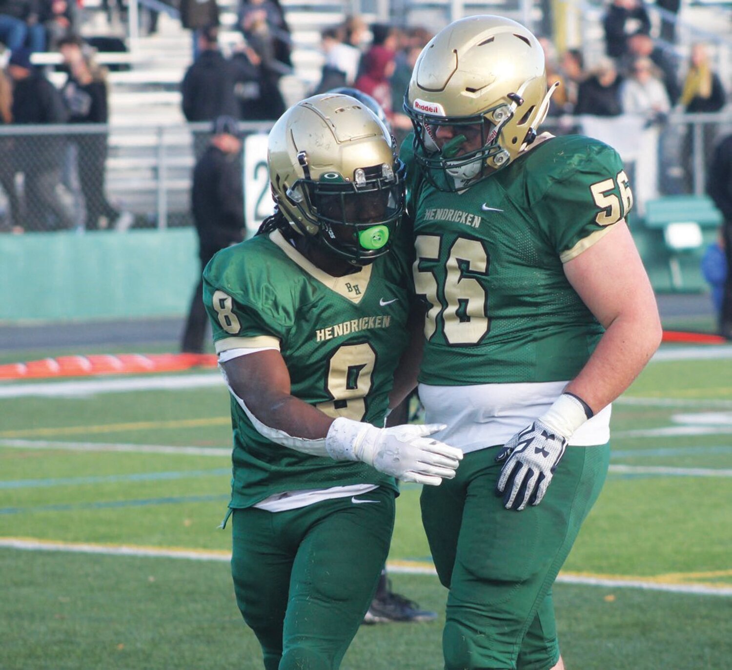 RUNNING AWAY WITH IT: Hendricken running back Oscar Weah (left) and Stephen Antonucci after Weah scored in the fourth quarter.