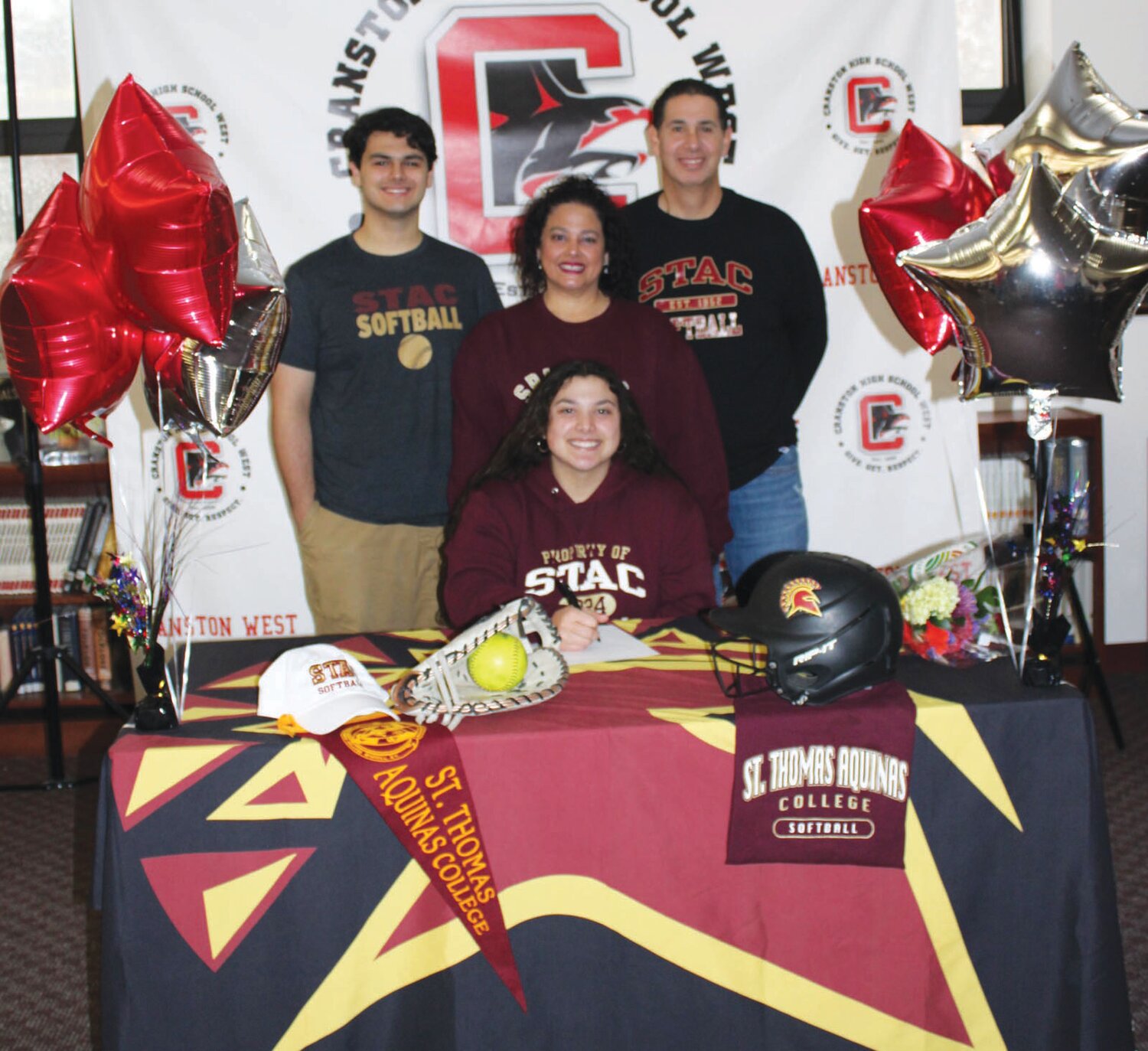 ALL ABOUT FAMILY: Sofia Marella signs her NLI alongside her family.